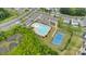 Aerial view of community pool, tennis court, playground and parking at 16404 Wavenly House Dr, Charlotte, NC 28273