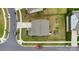 An aerial view of a home and yard, showing a playground in the fenced backyard at 16404 Wavenly House Dr, Charlotte, NC 28273
