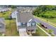 An aerial view of a beautiful home and surrounding neighborhood with mature trees and well-manicured lawns at 16404 Wavenly House Dr, Charlotte, NC 28273