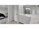 Bathroom with double sinks, modern finishes, and a view into the bedroom at 16404 Wavenly House Dr, Charlotte, NC 28273