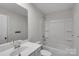 Bathroom features a large mirror, vanity sink, and shower/tub combo at 16404 Wavenly House Dr, Charlotte, NC 28273