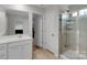 Bathroom featuring a sink, shower, and modern fixtures for a clean and functional space at 16404 Wavenly House Dr, Charlotte, NC 28273