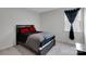 Cozy bedroom featuring a bed, window, and neutral decor for a calming retreat at 16404 Wavenly House Dr, Charlotte, NC 28273