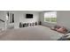 The bonus room features carpeted floors, a window, and space for entertaining friends and Gathering at 16404 Wavenly House Dr, Charlotte, NC 28273