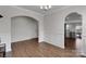 Bright dining room featuring an archway leading to other rooms and stylish wainscoting at 16404 Wavenly House Dr, Charlotte, NC 28273