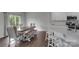 Bright dining room with a table, bench, chairs, and sliding door to the outdoors at 16404 Wavenly House Dr, Charlotte, NC 28273