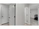 The hallway has a tile floor and provides access to the bedrooms and bathrooms at 16404 Wavenly House Dr, Charlotte, NC 28273