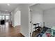 Spacious hallway with archways and view into a study or office area at 16404 Wavenly House Dr, Charlotte, NC 28273