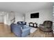 Comfortable living room with sofas, a TV, and a neutral color scheme at 16404 Wavenly House Dr, Charlotte, NC 28273