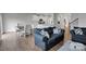 Spacious living space with an open kitchen, dining area, and comfortable seating at 16404 Wavenly House Dr, Charlotte, NC 28273