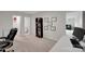 Office space with a bookshelf and multiple framed certificates on the wall at 16404 Wavenly House Dr, Charlotte, NC 28273