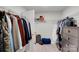 This walk-in closet features wire shelving, a storage dresser, and plenty of room for clothes and accessories at 16404 Wavenly House Dr, Charlotte, NC 28273