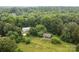 Aerial shot of a wooded homesite with a storage building, set amid natural surroundings at 168 Pleasant Creek Dr, Cleveland, NC 27013