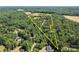 Expansive aerial view of property boundaries, showcasing lush greenery and surrounding landscape at 168 Pleasant Creek Dr, Cleveland, NC 27013