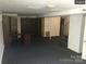 Finished basement featuring carpeting, built-in shelving, and access to stairs at 168 Pleasant Creek Dr, Cleveland, NC 27013