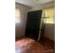Empty bedroom with hardwood floors, windows, and minimalist setup at 168 Pleasant Creek Dr, Cleveland, NC 27013