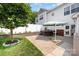 Landscaped backyard boasts a brick patio and a relaxing hot tub at 18137 Amberwood Glen Dr, Cornelius, NC 28031