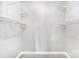 The white, walk-in closet has shelving to hold all your things and carpeted floors at 18137 Amberwood Glen Dr, Cornelius, NC 28031