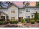 Two-story townhouse displaying sunset background and landscaped garden at 18137 Amberwood Glen Dr, Cornelius, NC 28031