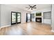 Bright living room with wood floors, fireplace, and access to the outdoor space at 18137 Amberwood Glen Dr, Cornelius, NC 28031