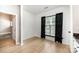 Cozy room with wood floors, black curtains, and natural light at 18137 Amberwood Glen Dr, Cornelius, NC 28031