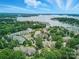 Aerial view of beautiful condos with water views, surrounded by lush trees at 18817 Nautical Dr # 302, Cornelius, NC 28031