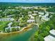 Extensive aerial view of numerous condos surrounded by lush greenery and a pond at 18817 Nautical Dr # 302, Cornelius, NC 28031