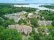 Overhead view of residential condos nestled within a lush green, wooded area at 18817 Nautical Dr # 302, Cornelius, NC 28031