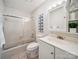 This bathroom offers a shower and tub combo, with a bright vanity and mirror at 18817 Nautical Dr # 302, Cornelius, NC 28031