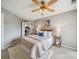 Comfortable bedroom featuring a ceiling fan, soft rug, and an open doorway to other rooms at 18817 Nautical Dr # 302, Cornelius, NC 28031
