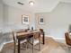 Intimate dining room showcasing neutral walls and modern decorative paintings at 18817 Nautical Dr # 302, Cornelius, NC 28031