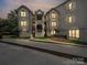 A three story condo with well-maintained siding, lit balconies and easy access from the sidewalk at 18817 Nautical Dr # 302, Cornelius, NC 28031