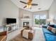 Bright living room features a fireplace, modern furniture, and an outdoor view at 18817 Nautical Dr # 302, Cornelius, NC 28031