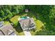 Beautiful aerial view of home and backyard featuring a lovely pool and shed at 1970 Topaz Plz, Davidson, NC 28036