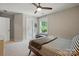 Bedroom with carpet and an outside view from the large window, as well as a ceiling fan at 1970 Topaz Plz, Davidson, NC 28036