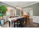 Stylish dining room open to other living spaces featuring modern decor and wood floors at 1970 Topaz Plz, Davidson, NC 28036