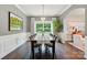 Elegant dining room with wainscoting, dark wood floors, and abundant natural light at 1970 Topaz Plz, Davidson, NC 28036