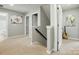 Upstairs hallway with neutral paint, carpet, and white trim and doors at 1970 Topaz Plz, Davidson, NC 28036