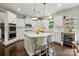 Bright kitchen with white cabinets, stainless steel appliances, and center island at 1970 Topaz Plz, Davidson, NC 28036