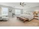 Spacious main bedroom with ample natural light, ceiling fan, and elegant furnishings at 1970 Topaz Plz, Davidson, NC 28036