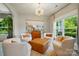 Cozy sitting room with comfortable chairs, decorative lighting, and natural light at 1970 Topaz Plz, Davidson, NC 28036
