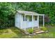 Cozy backyard storage shed with covered porch and well-maintained landscaping at 1970 Topaz Plz, Davidson, NC 28036