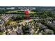 Aerial view of the home's location in relation to the community clubhouse and surrounding neighborhood at 203 Rustling Waters Dr, Mooresville, NC 28117