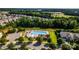 Aerial view of the community swimming pool and surrounding neighborhood at 203 Rustling Waters Dr, Mooresville, NC 28117