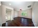 Bright bedroom with hardwood floors, large window, and ceiling fan at 203 Rustling Waters Dr, Mooresville, NC 28117