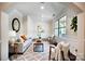 Beautiful staged living room featuring elegant furniture, a patterned rug, and natural light from the window at 203 Rustling Waters Dr, Mooresville, NC 28117