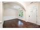The living room features hardwood floors, large windows providing natural light, and elegant molding at 203 Rustling Waters Dr, Mooresville, NC 28117