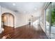 Spacious living room with hardwood floors, a fireplace, and large windows leading to the backyard at 203 Rustling Waters Dr, Mooresville, NC 28117