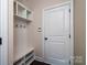 Cozy mudroom with built-in bench, cubbies, and coat hooks, perfect for organization at 203 Rustling Waters Dr, Mooresville, NC 28117