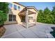 Covered back patio featuring a concrete flooring and access to a small in-ground pool at 203 Rustling Waters Dr, Mooresville, NC 28117